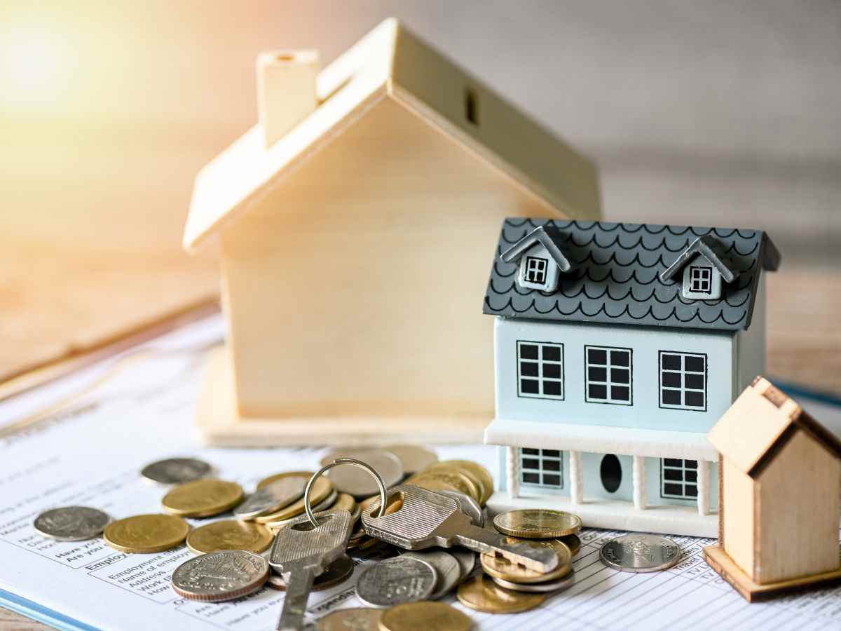 Case e monete per rappresentare un mutuo