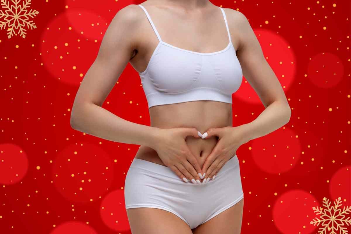 Mani a cuore sulla pancia